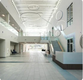 Renovated corporate lobby with glass stairway
